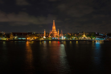 Fototapeta na wymiar River and Wat Arun Temple at night in Bangkok Thailand