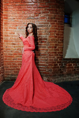 Fototapeta premium Full length shot of fashionable model girl at pink evening dress