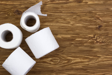 Toilet paper on wooden board