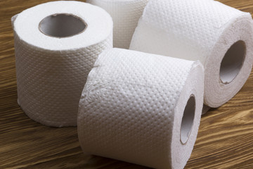 Toilet paper on wooden board