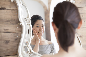 Women have to check the skin look in the mirror