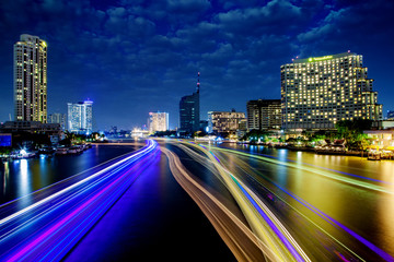 Fototapeta na wymiar Light effects over time after sunset on Chao Phraya river in Bangkok City, Thailand.