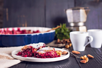 Cherry pie and a cup of coffee. Rustic style. Berry pie. Homemade cherry pie with flaky crust, cup of coffee, bowl with cherries