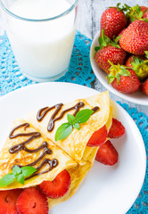 Pancakes with sliced strawberries