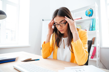 Businesswoman thinking about work in office
