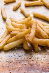 fries on steel plate with salt