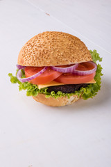 homemade hamburger on white table