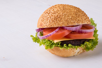 homemade hamburger on white table