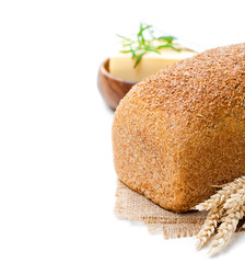 Whole  slow-baked organic wholemeal bread with butter and rosema