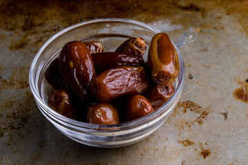 dried dates on steel plate