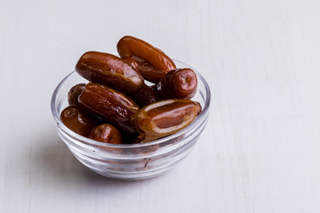 dried dates on white table