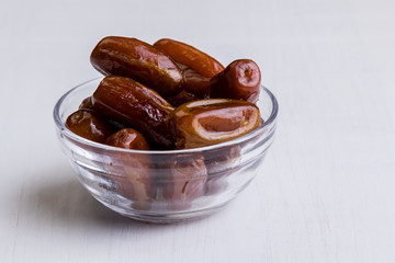 dried dates on white table