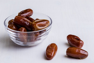 dried dates on white table