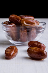 dried dates on white table