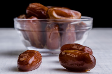 dried dates on white table