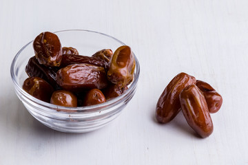 dried dates on white table