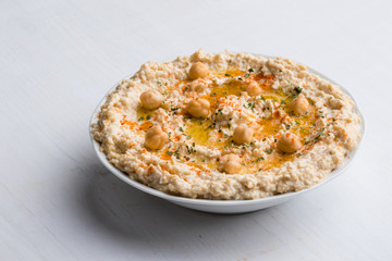 hummus on white table