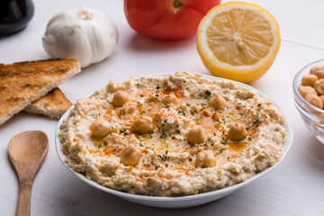 hummus on white table