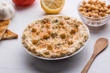 hummus on white table