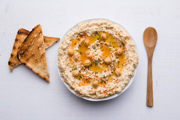 hummus on white table