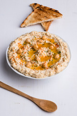 hummus on white table