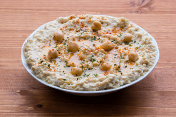 home made hummus on wooden table