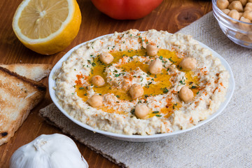 home made hummus on wooden table