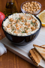 hummus in black bowl