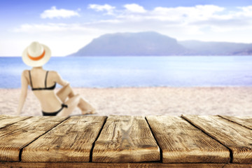 table and woman on sand 