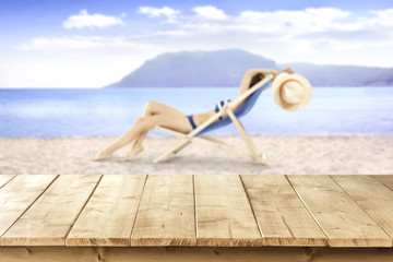 table and woman on sand 