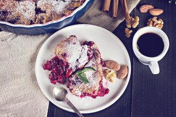 Cherry pie and a cup of coffee. Rustic style. Berry pie. Homemade cherry pie with flaky crust, cup of coffee, bowl with cherries