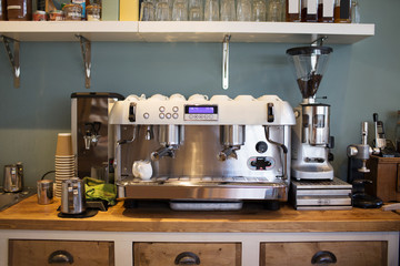Professional coffee machine making espresso in a cafe