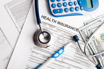 Health care costs. Stethoscope and calculator symbol for health