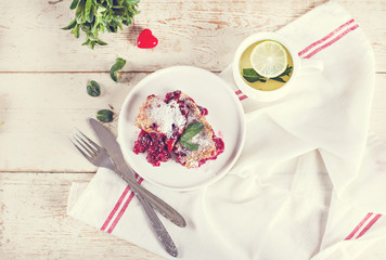 Cherry pie and a cup of tea. Rustic style. Berry pie. Homemade cherry pie with flaky crust, cup of coffee, bowl with cherries