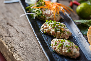 Fish tartare with herbs and carrot