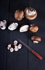 Fresh mushrooms  on a black board. Champignon mushrooms