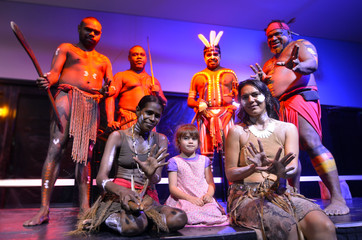 Little girl photographed with Native Australia people