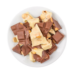 Pieces of dark and white chocolate in a plate on a