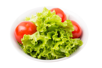 tomatoes and greens in a plate