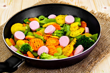 Steamed Vegetables Potatoes, Carrots and Broccoli with Sausages 