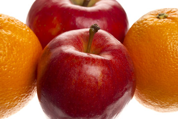 close-up combination of oranges and apples