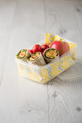 Ham and cheese wraps in lunch box