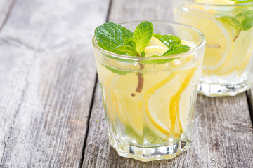 refreshing mint lemonade on a wooden background