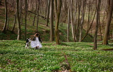 young ladies walk outdoors with her pet