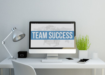 modern clean workspace with team success keyworkds on screen