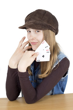 Pretty Girl With Four Aces In Hand Looking At The Camera, Studio Shot Isolated On White