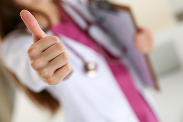 Female medicine doctor holding document pad