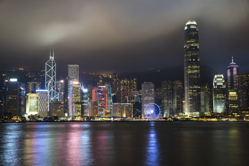 Fototapeta na wymiar Night city scape on Hong Kong Harbour.