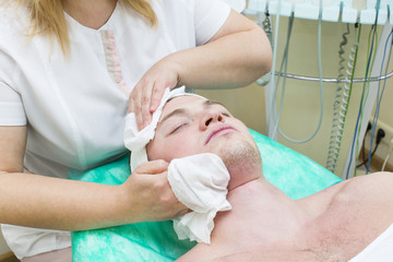 man in the mask cosmetic procedure in spa salon