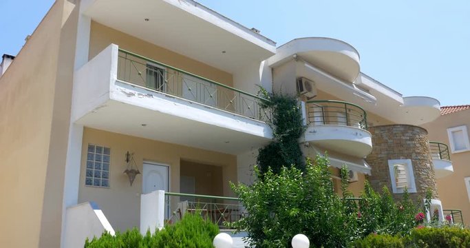 Entrance into the two-storey house and its overall plan.
